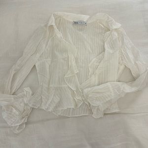 Zara women’s white semi-sheer button up blouse with ruffle details